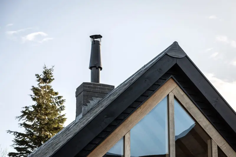 Timber gable and chimney of a contemporary home