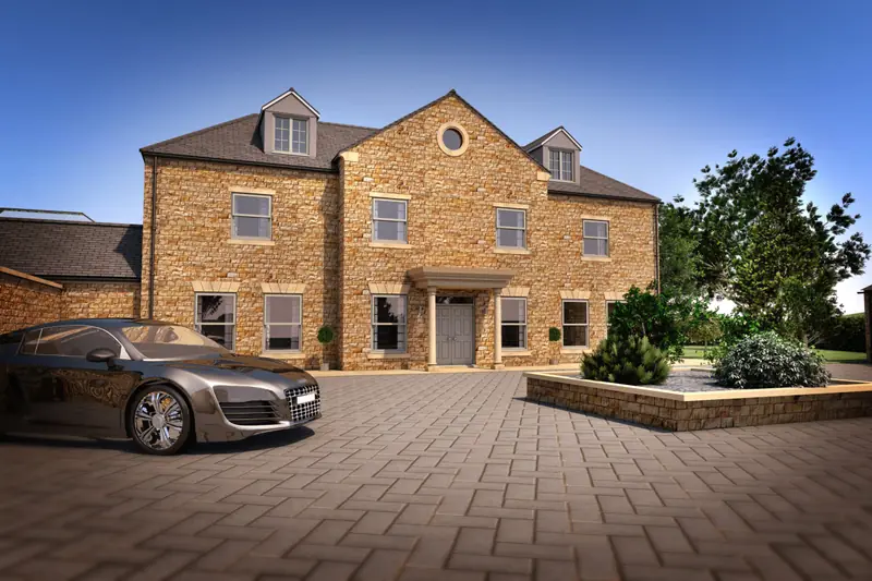 Large stone-built detached house with a block-paved driveway